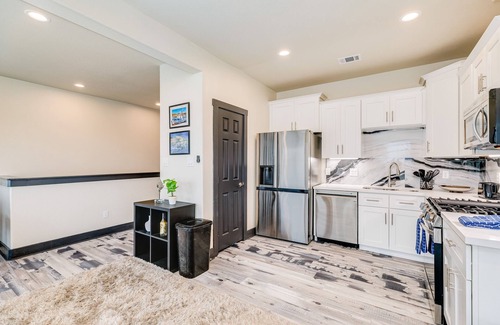 Bacliff House | Vibrant orange retreat with an enclosed yard, grill, and ocean views - dogs ok