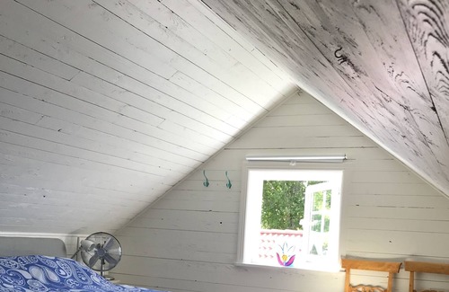 Harnosand Cottage | View of lake and mountains in west orientation, with sauna and jetty