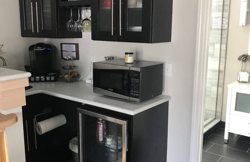 Lake Fenton Apartment | View of Lake Fenton with hot tub and fire place