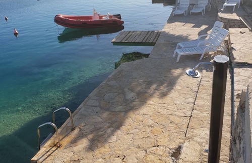 Grebastica House | Villa Andrea, half of the house directly by the sea, in-house beach, boat dock