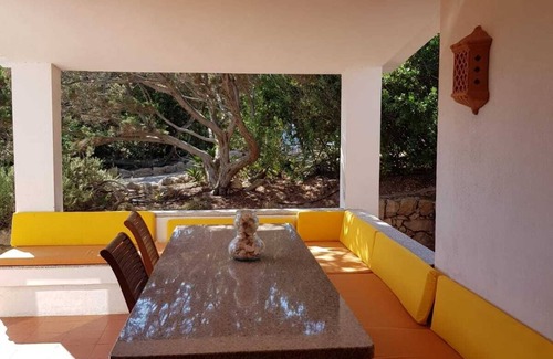Portobello di Gallura Villa | Villa a short walk from the sea surrounded by a garden with trees, plants and flowers