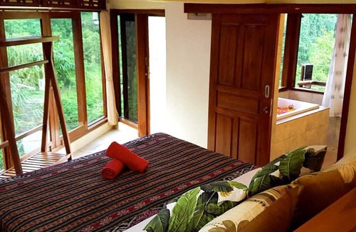 Sukasada Bed & Breakfast | Villa Ayu offers stunning view over mountains green valley with waterfall