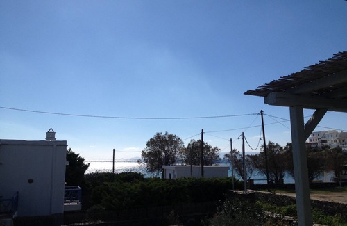 Exomvourgo House | Villa Elia - The charm of Tiniote architecture feet in the water!