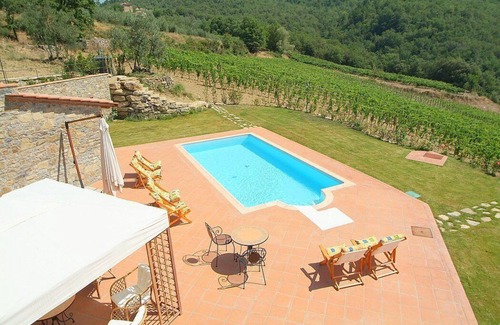 Gaiole in Chianti Villa | Villa Eracle: A bright and elegant three-story villa surrounded by vineyards and olive groves.