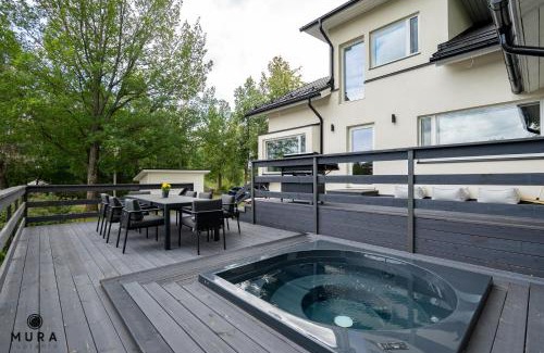 Lempaala Villa | Villa Gaia - Luxury villa with jacuzzi and beach close to trainstation 10 minutes from Tampere city! 1,5 hours to Helsinki