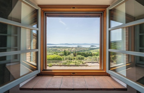 Passignano sul Trasimeno Villa | Villa with large pool that blends with the lines of the lake Trasimeno