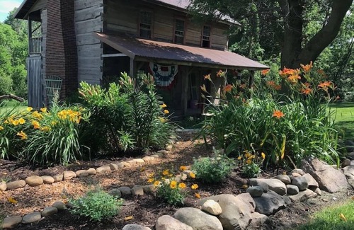Flora Cabin | Vintage 1850's Log Cabin Glamping