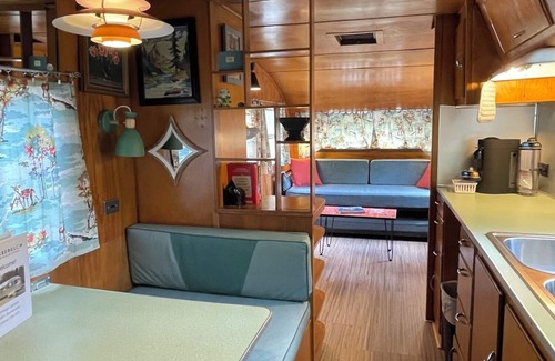 Mill Spring House | Vintage camper on the creek, short walk to pool and playground, deck, gas grill, sleeps 2.