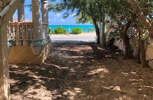 Providenciales Apartment | Wake up to Pelicans cruising the beach!