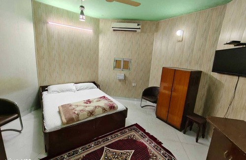 Jaipur District Resort | Walking distance jaipur international airport terminal2 big garden area room.