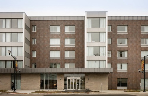 Historic East Village Condo | Warm and Welcoming Suite | Free Breakfast, Indoor Pool + Hot Tub