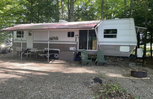 Bliss RV Rental | Waterfront camper in Adirondack-like setting