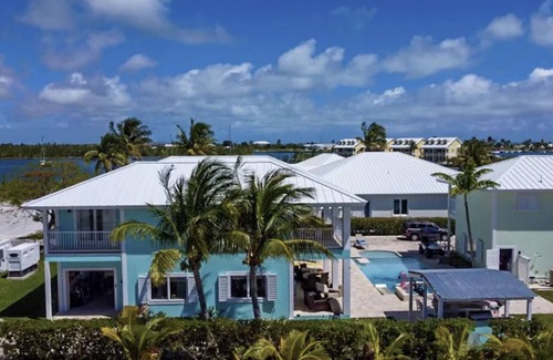 Treasure Cay House | WATERFRONT FAMILY COMPOUND 3 HOMES SLEEPS 30 WITH POOL, 3 BOAT SLIPS