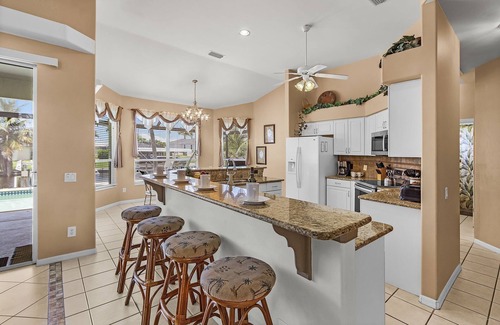 Pelican House | Waterfront Fun with Heated Pool, Private Dock & Gulf Access – Tropical Delight - Roelens