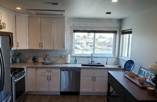 Discovery Bay House | Waterfront Home with large boat dock & boat rental and other water toys