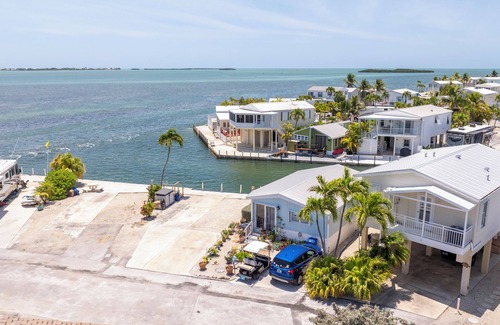 Cudjoe Key RV Rental | Waterfront RV Lot Just 2 Spots from Open Water with 35' Seawall—Fish, Boat & Relax in Paradise!