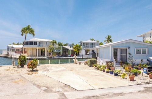 Cudjoe Key RV Rental | Waterfront RV Lot Just 2 Spots from Open Water with 35' Seawall—Fish, Boat & Relax in Paradise!