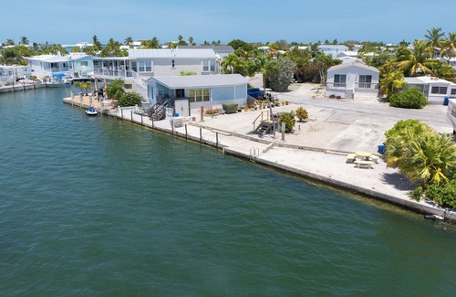 Cudjoe Key RV Rental | Waterfront RV Lot Just 2 Spots from Open Water with 35' Seawall—Fish, Boat & Relax in Paradise!