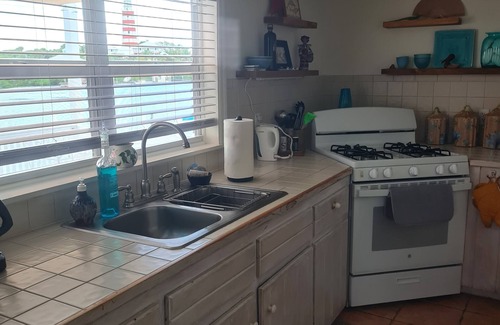 Lubbers Quarters Cay Villa | WATERFRONT VILLA with deck to enjoy the scenic views & historical lighthouse.