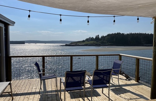 Georgetown Cottage | Waterfront, west facing, modernized fisherman’s cottage perched on the water.