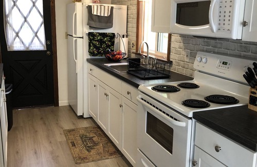Pocono Lake Ski Chalet | Waterview, air conditioning, adjacent to the beach, covered front and rear decks