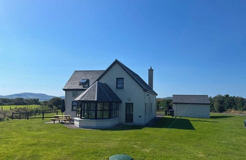 Waterville House | Waterville Luxury: 4BR Retreat Steps from Beach, Golf & Scenic Views
