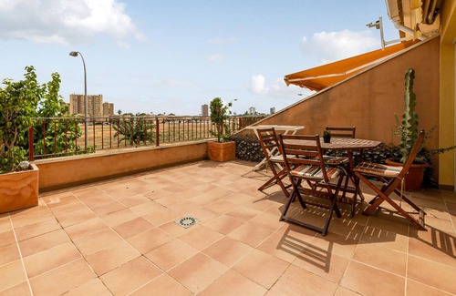 Santiago de la Ribera Apartment | Welcome to this compact vacation apartment, which guarantees you the sea view on two roof terraces.