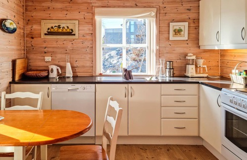 Risor House | Welcome to this inviting cottage by the sea.