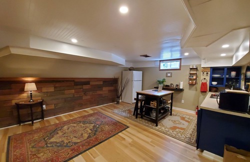 Concordia House | Well appointed basement guest suite with private entrance & backyard oasis.