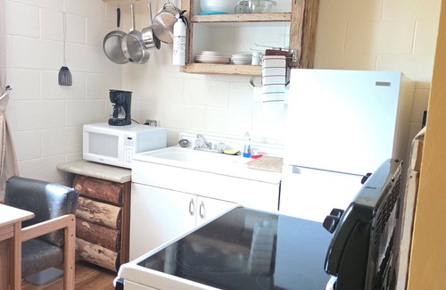 Cedaredge Cabin | Where the Creek Giggles and the Pillows Hug Back. King Bed with Full Kitchen.