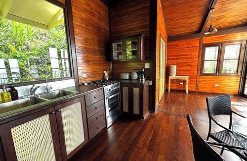 Brewers Bay Cottage | Whole Bayview Cottage with large deck and sea view, mid-way to beaches and town.