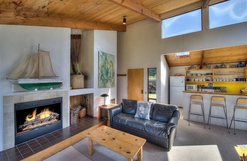 Sea Ranch House | Wide open meadow view with ocean peeks through the trees.