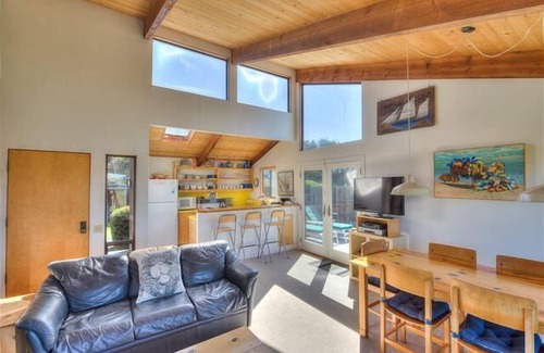 Sea Ranch House | Wide open meadow view with ocean peeks through the trees.