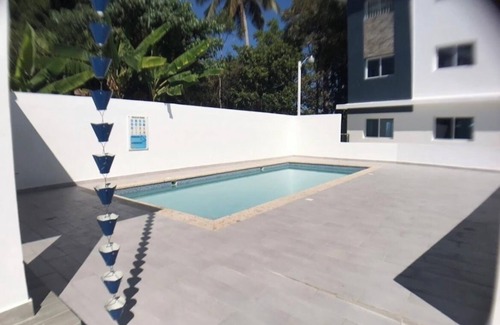 Moca Apartment | wifi, parking, Netflix, pool, ac, cable, terraza familiar.