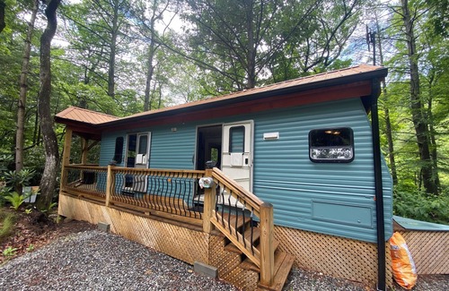 Deep Gap House | “Wild Blue Yonder “is a camper set up on a permanent foundation
