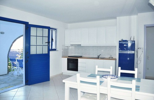 Tinos House | Windmill and houses by the sea // Stavros Bay