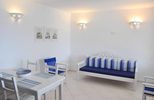 Tinos House | Windmill and houses by the sea // Stavros Bay