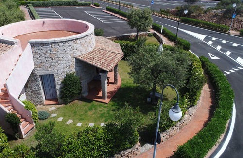 Porto San Paolo House | Wonderful head-end villa with large garden and solarium