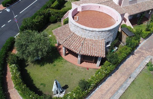 Porto San Paolo House | Wonderful head-end villa with large garden and solarium