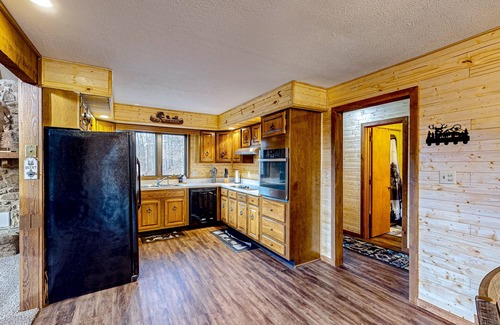 Gnaw Bone House | Wooded acreage with wrap-around deck, hot tub, central AC, & game room