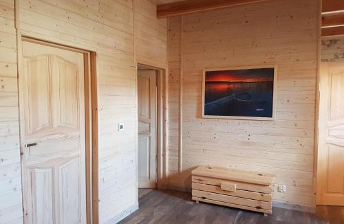 gmina Osiek House | Wooden Holiday Home in Skrzynia with Terrace