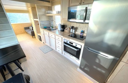 Pear Park House | XL tiny home with two lofted queen beds and full size futon on the main level.