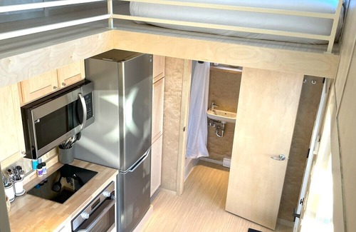 Pear Park House | XL tiny home with two lofted queen beds and full size futon on the main level.