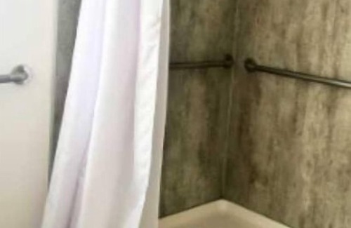 Hurricane Cabin | Yogi Bear Glamping Cabin 1 Bedroom/+ bunk set w/Full Bath Sky Deck - Over 800 sq. ft. (Accessible) - 1 Bedroom + Lower bunks/2 Bath with Skydeck and kid's loft area