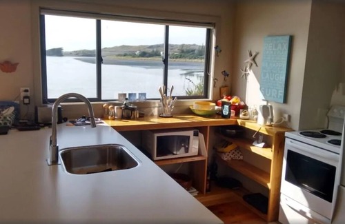 Waitomo District House | You can't get closer to the water if you tried