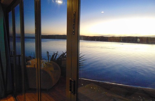 Waitomo District House | You can't get closer to the water if you tried