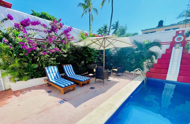 2 bed, 2 bath house w/private pool, pyramid waterfall, short walk to beach.