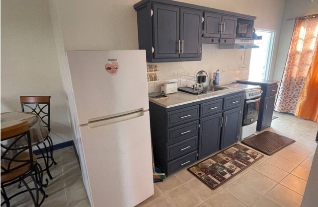 2-bedroom upstairs Apt in brilliant Bridgetown with WiFi, AC, full kitchen etc.