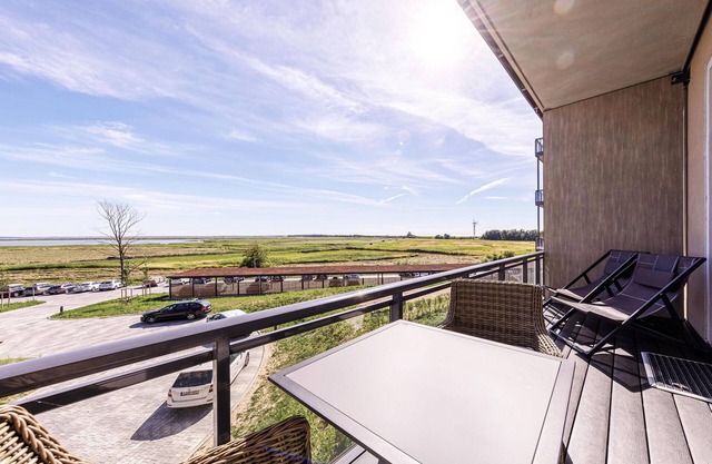 5 star vacation apartment Wellenreiter- south view of the Saaler Bodden & beach chair