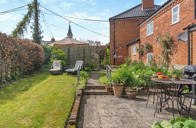 A beautifully curated cottage sleeping four with two sleek bathrooms.